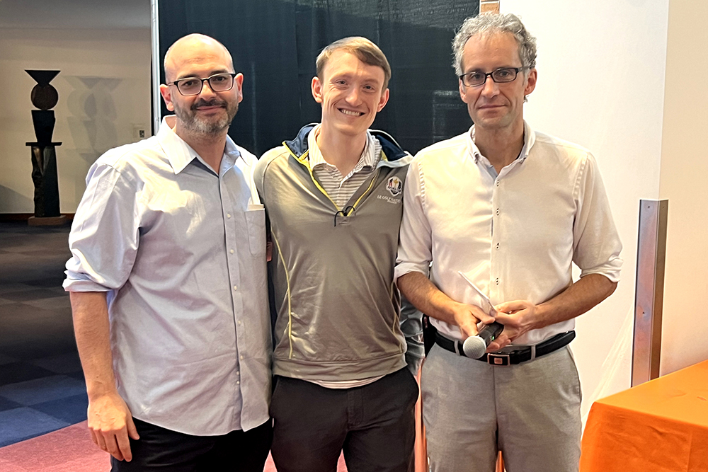 Matthew Hughes in the center with Matteo Buccito the left and Jacopo Buongiorno to the right, in a row, MIT